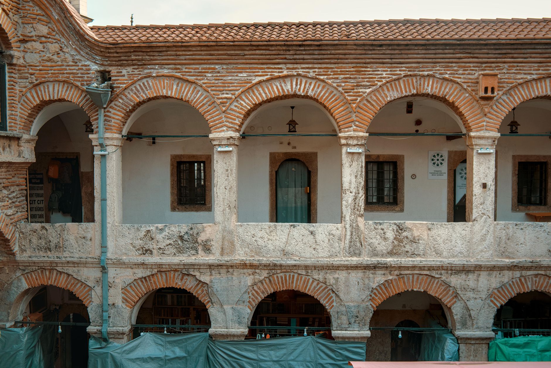 A traveler admiring ancient architectural courtyard